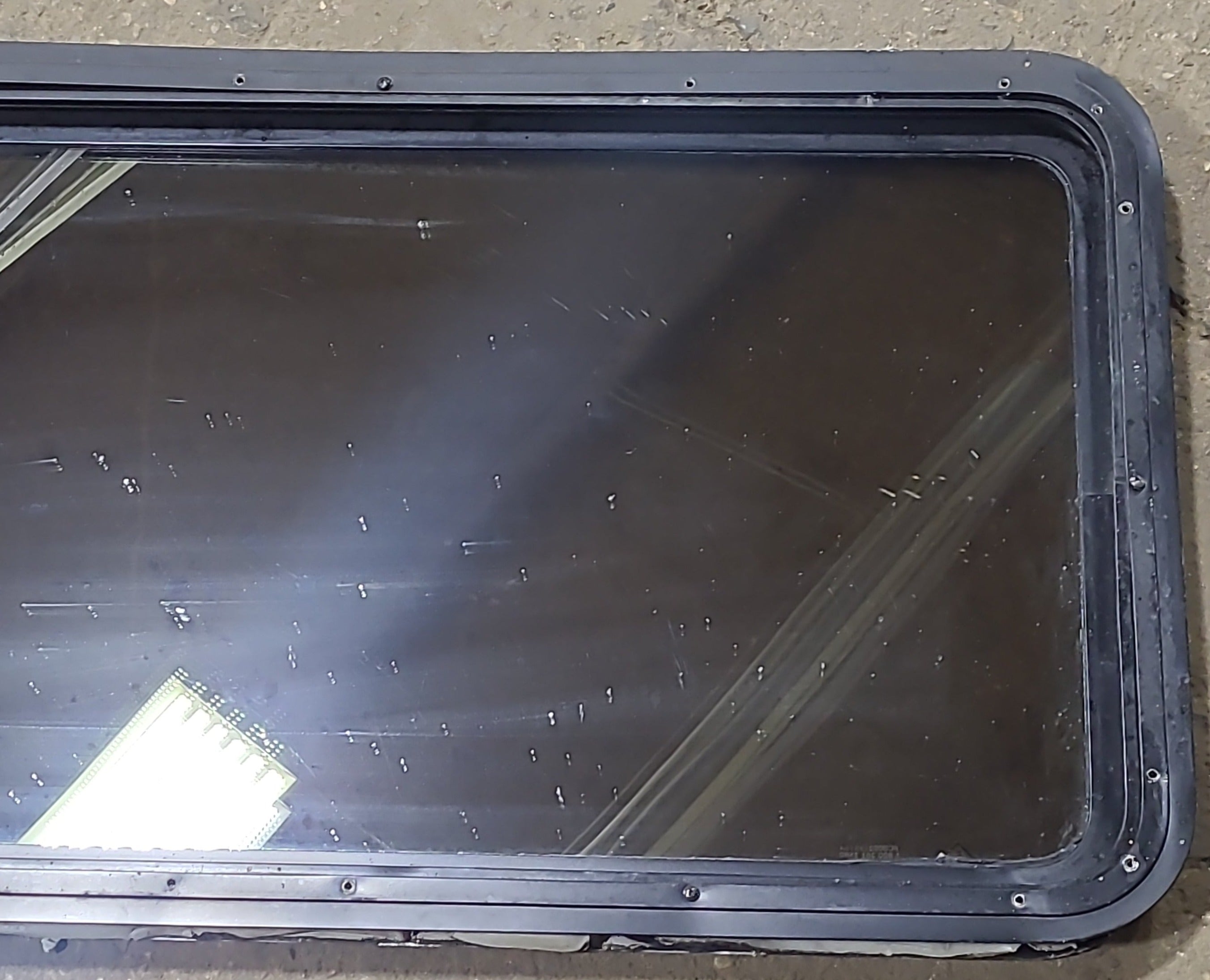 Used Black Radius Non Opening Window : 42 1/4" W x 21 1/2" H x 2" D - Young Farts RV Parts