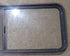 Used Black Radius Opening Window : 54 1/4" W x 21 3/4" H x 1 7/8" D - Young Farts RV Parts