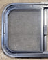 Used Black Radius Opening Window : 23 1/4" W x 14 1/4" H x 1 1/4" D - Young Farts RV Parts