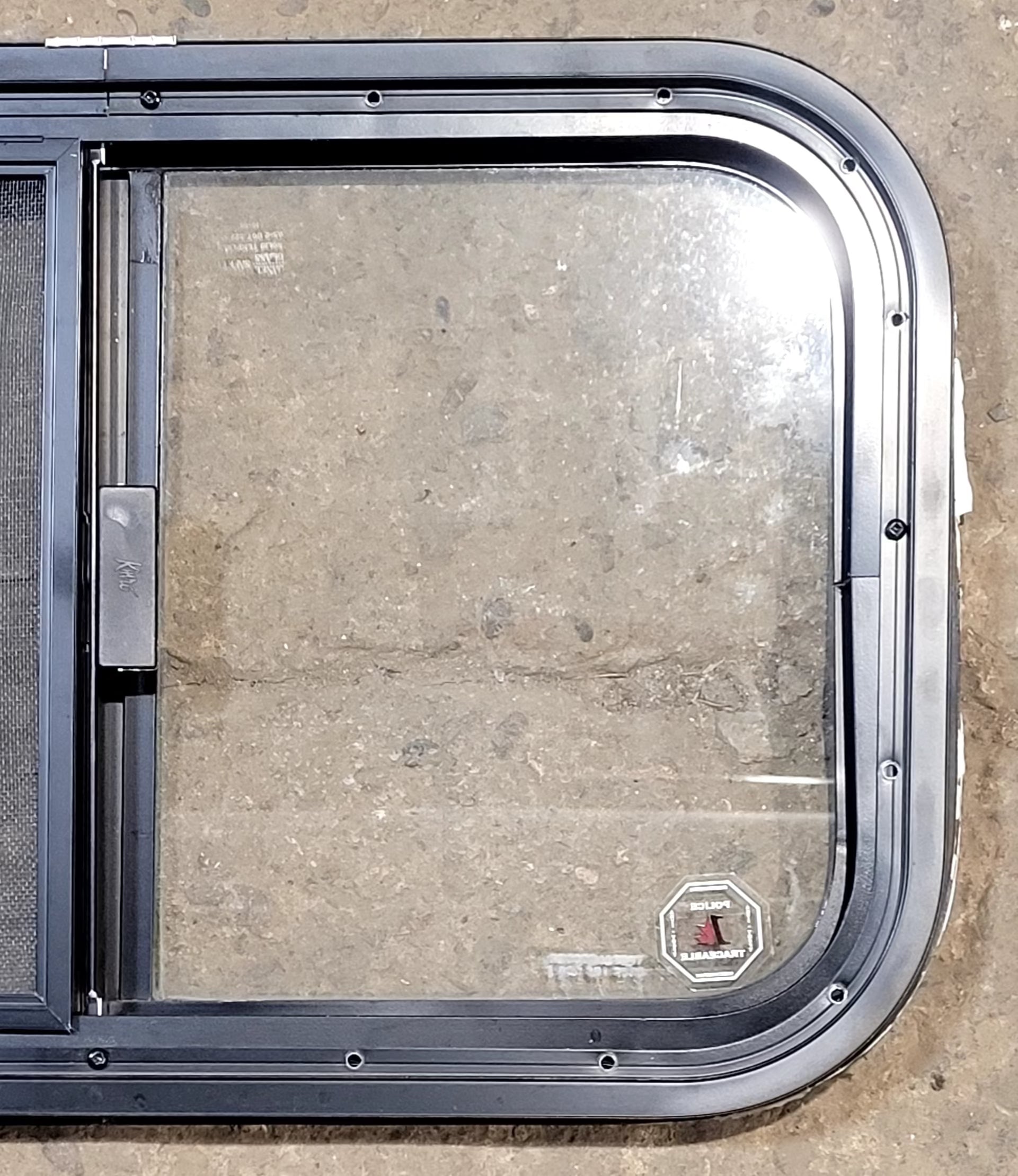 Used Black Radius Opening Window : 23 1/4" W x 14 1/4" H x 1 1/4" D - Young Farts RV Parts
