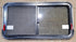 Used Black Radius Emergency Opening Window : 41 1/4" W x 21 1/2" H x 1 1/4" D - Young Farts RV Parts