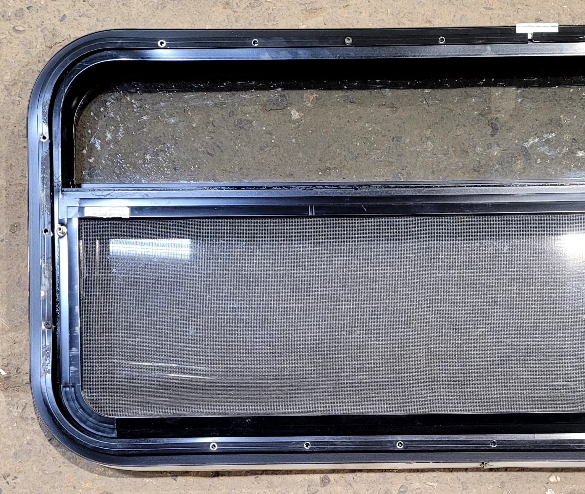 Used Black Radius Opening Window : 41 1/4" W x 17 1/4" H x 1 1/8" D - Young Farts RV Parts