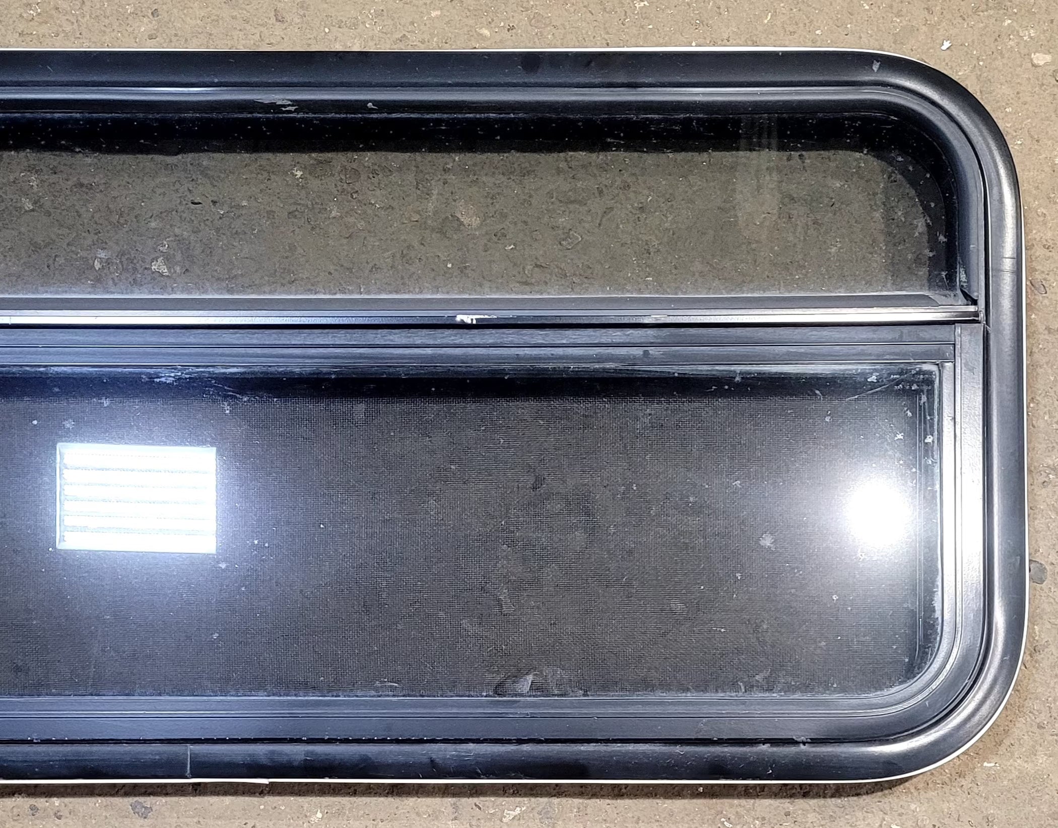 Used Black Radius Opening Window : 41 1/4" W x 17 1/4" H x 1 1/8" D - Young Farts RV Parts