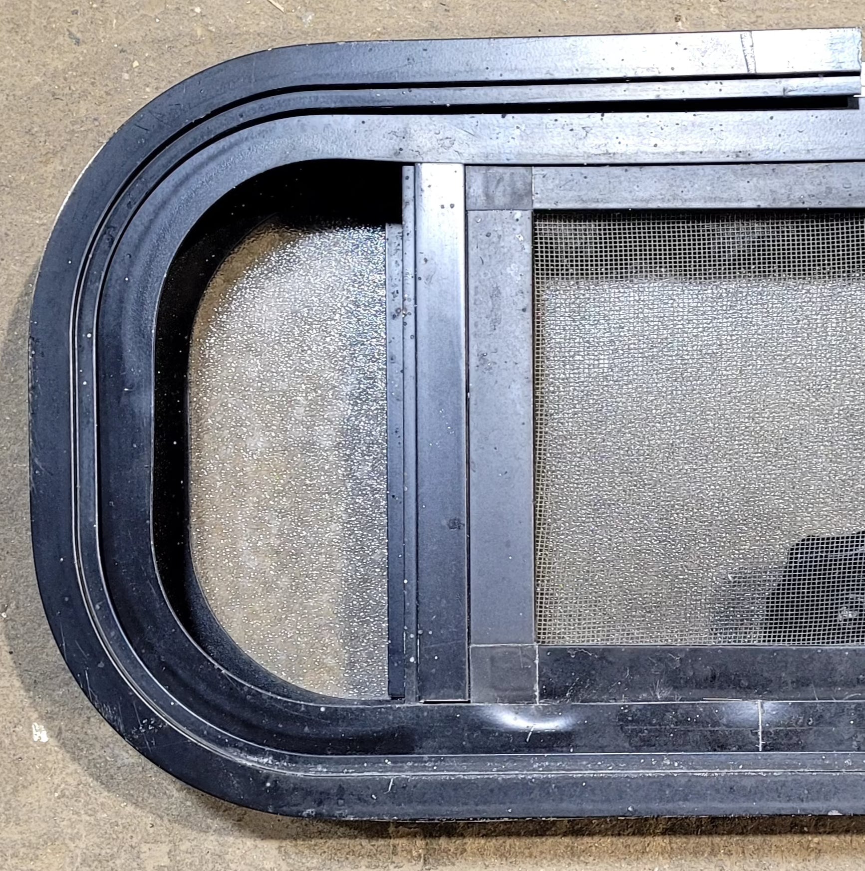 Used Black Radius Opening Window : 18 1/2" W x 9 1/2" H x 1 5/8" D - Young Farts RV Parts
