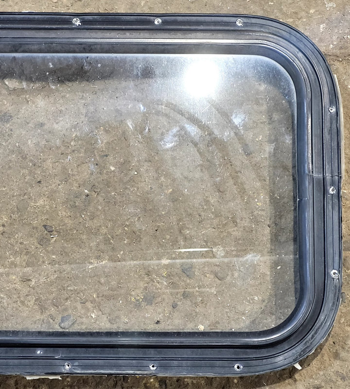 Used Black Radius Non Opening Window : 25" W x 16 3/4" H x 1 5/8" D - Young Farts RV Parts