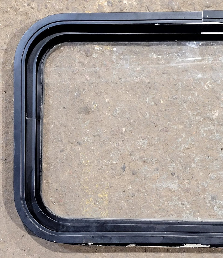 Used Black Radius Non Opening Window : 25" W x 16 3/4" H x 1 5/8" D - Young Farts RV Parts