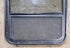 Used Black Radius Opening Window : 34 1/2" W x 23 1/2" H x 1 7/8" D - Young Farts RV Parts