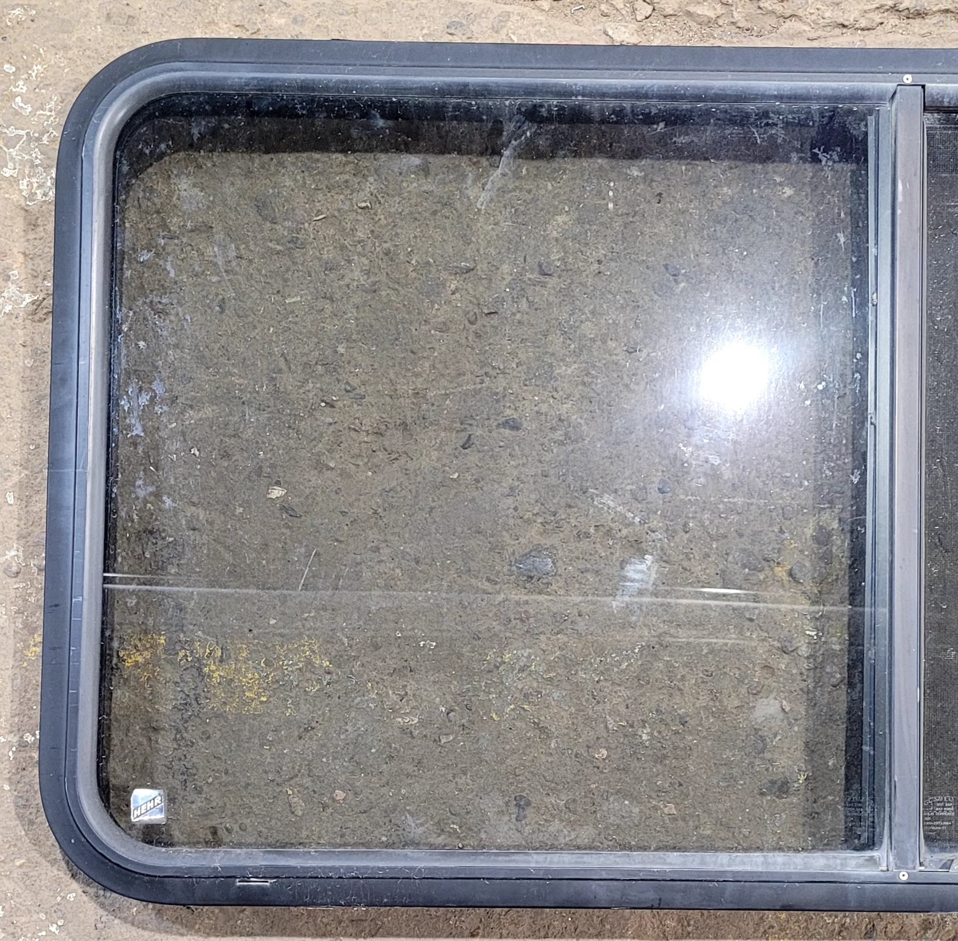 Used Black Radius Opening Window : 47 3/4" W x 23 3/4" H x 1 7/8" D - Young Farts RV Parts