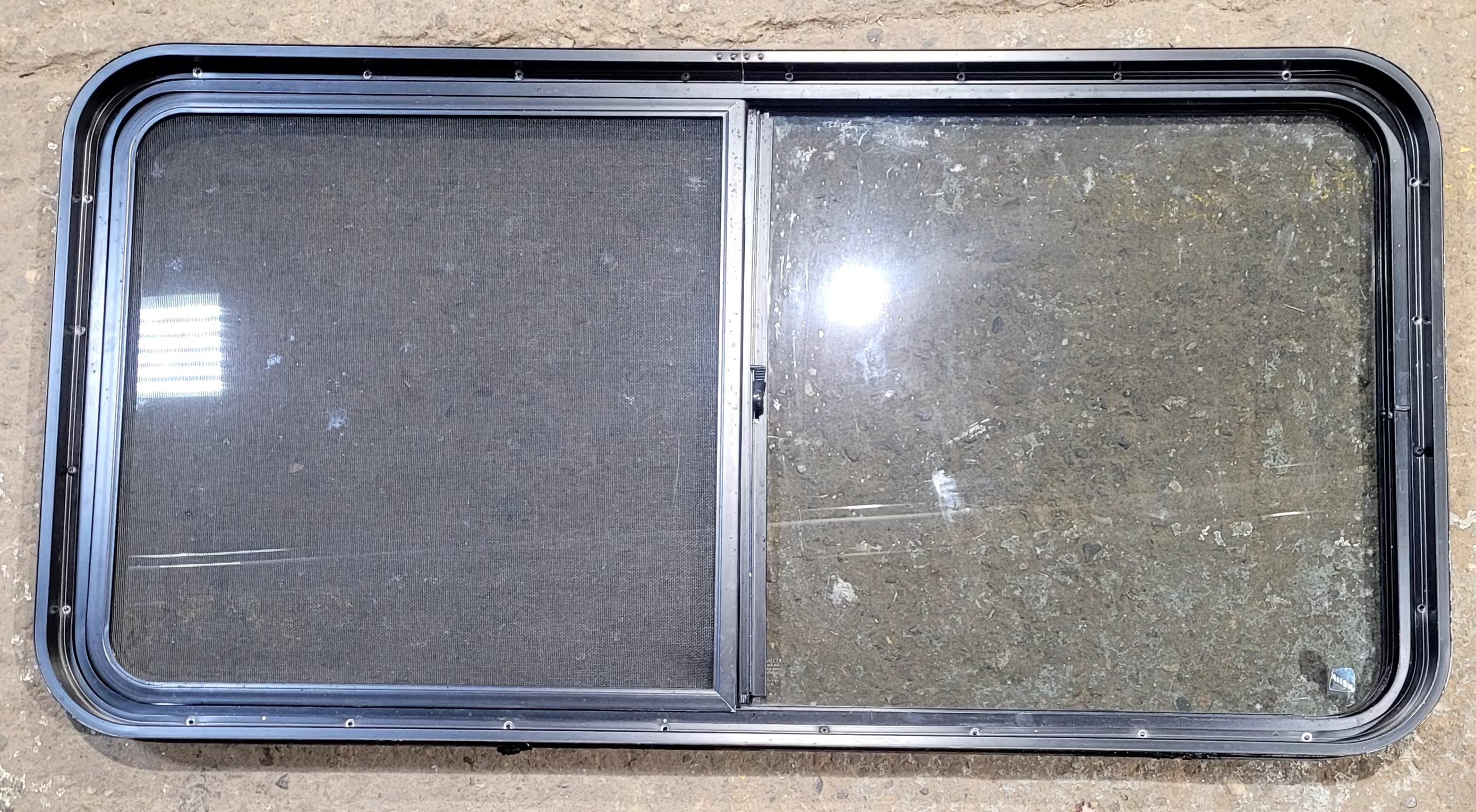 Used Black Radius Opening Window : 47 3/4" W x 23 3/4" H x 1 7/8" D - Young Farts RV Parts