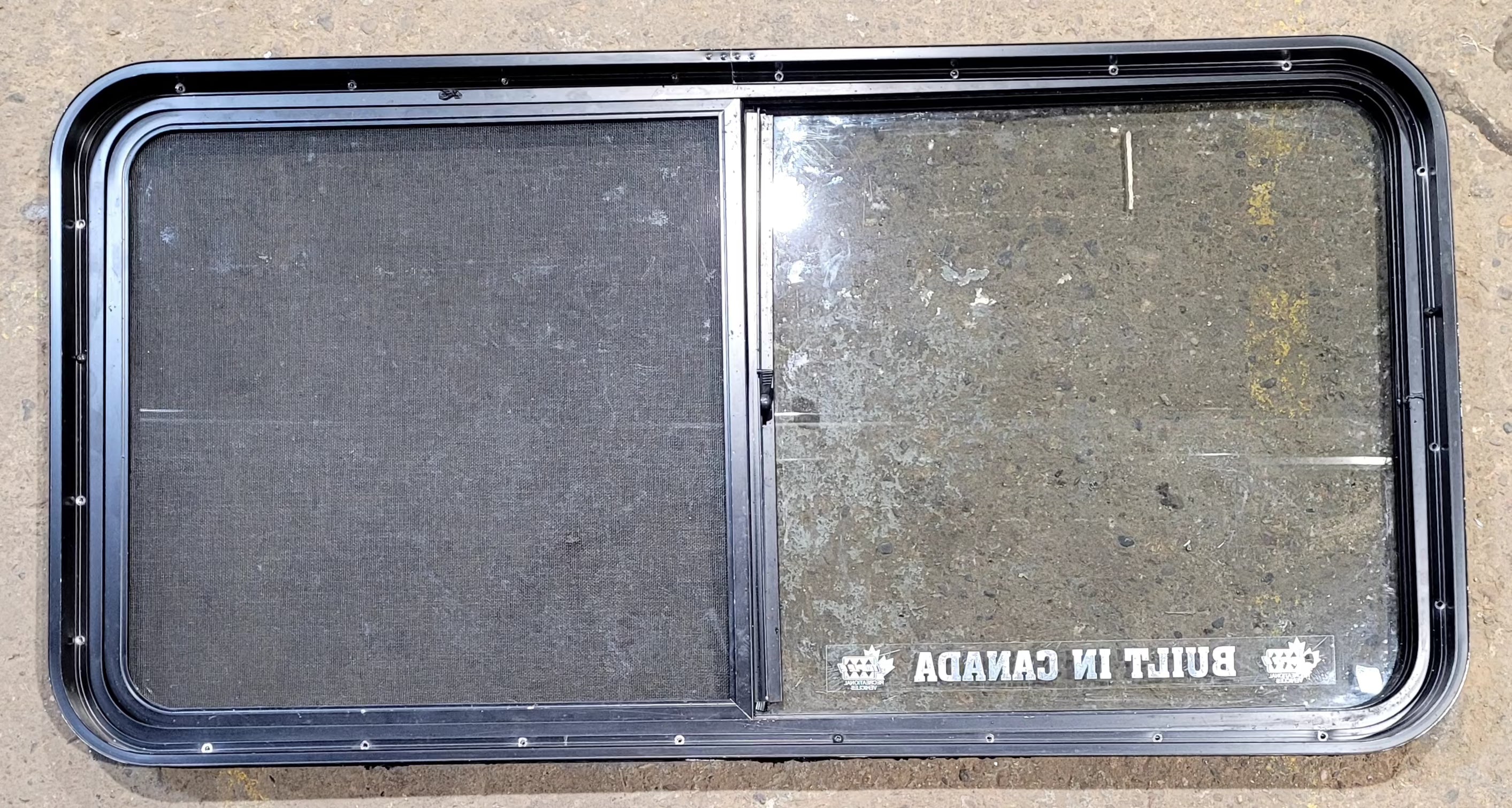 Used Black Radius Opening Window : 47 3/4" W x 23 3/4" H x 1 7/8" D - Young Farts RV Parts