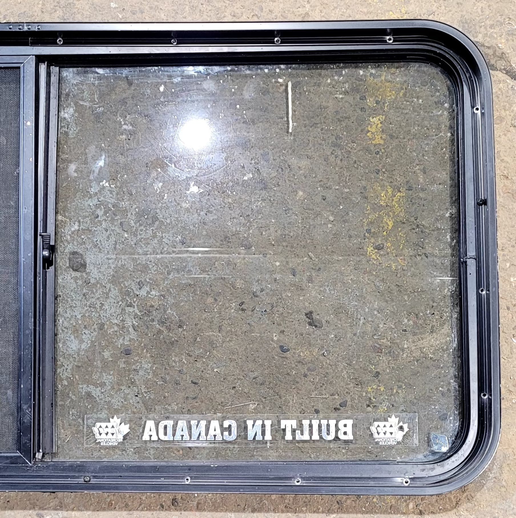 Used Black Radius Opening Window : 47 3/4" W x 23 3/4" H x 1 7/8" D - Young Farts RV Parts