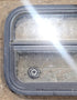 Used Black Radius Opening Window : 23 1/2" W x 14 1/2" H x 1 3/4" D - Young Farts RV Parts