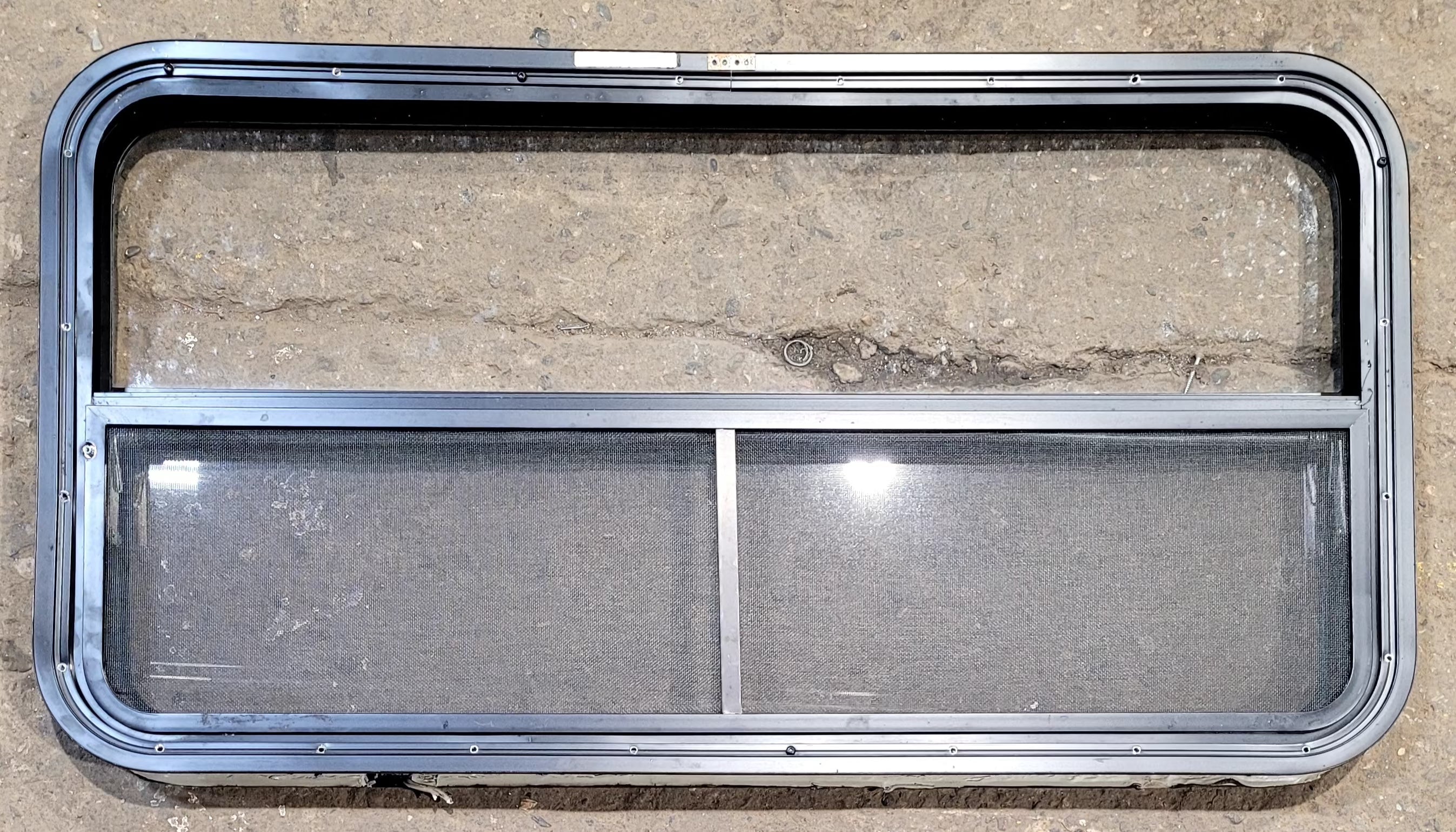 Used Black Radius Opening Window : 41 1/4" W x 21 1/4" H x 1 3/4" D - Young Farts RV Parts