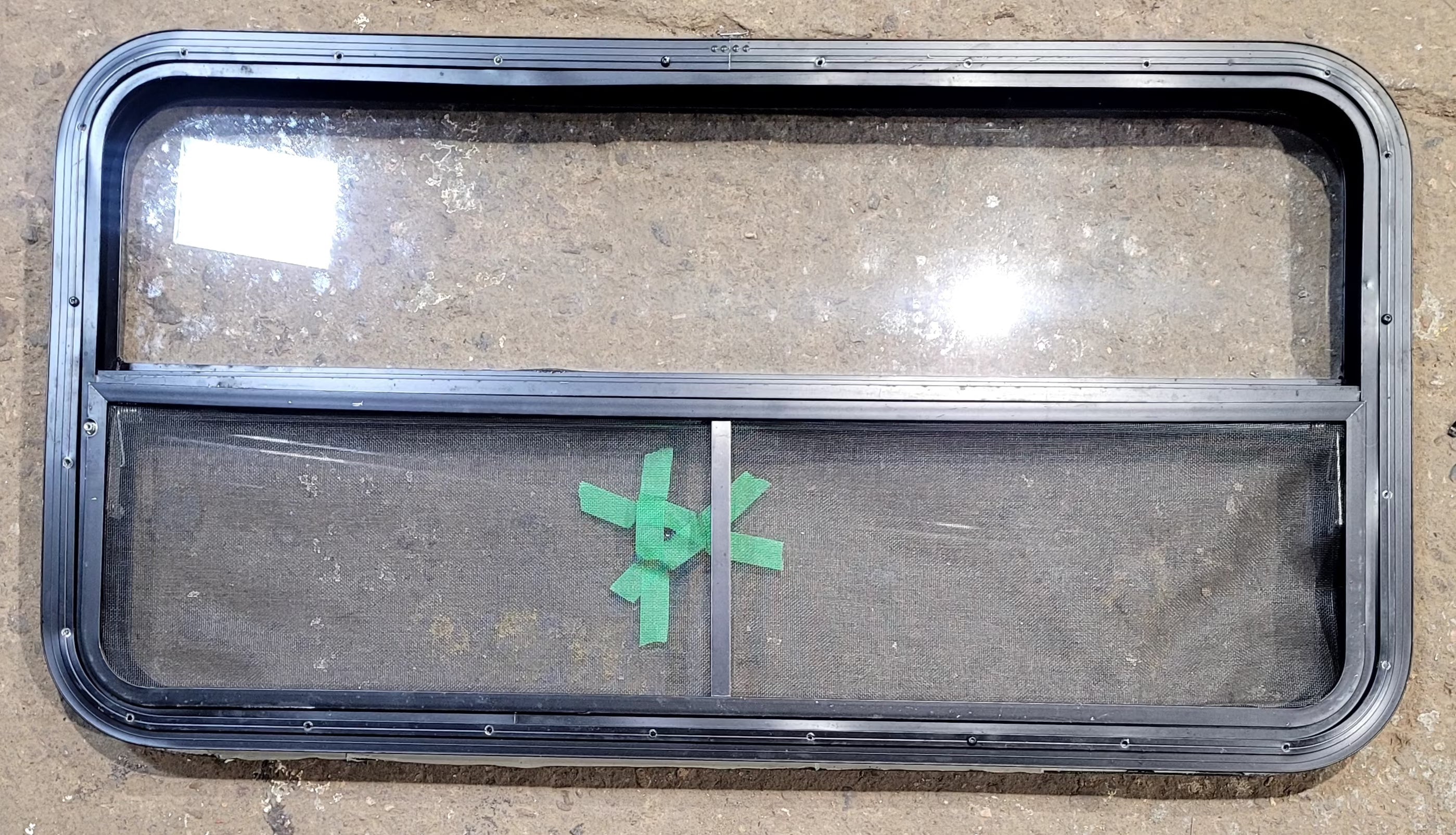 Used Black Radius Opening Window : 41 1/2" W x 21 1/2" H x 1 1/2" D - Young Farts RV Parts