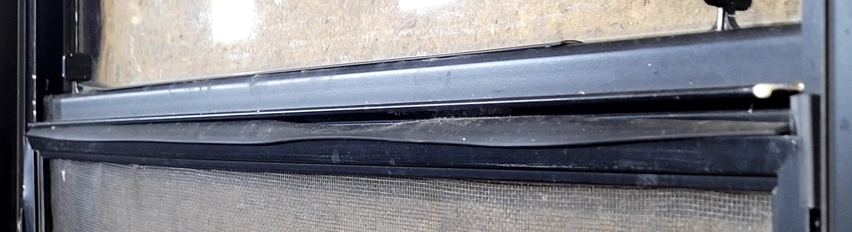 Used Black Radius Opening Window : 23 1/2" W x 21 1/4" H x 1 1/4" D - Young Farts RV Parts