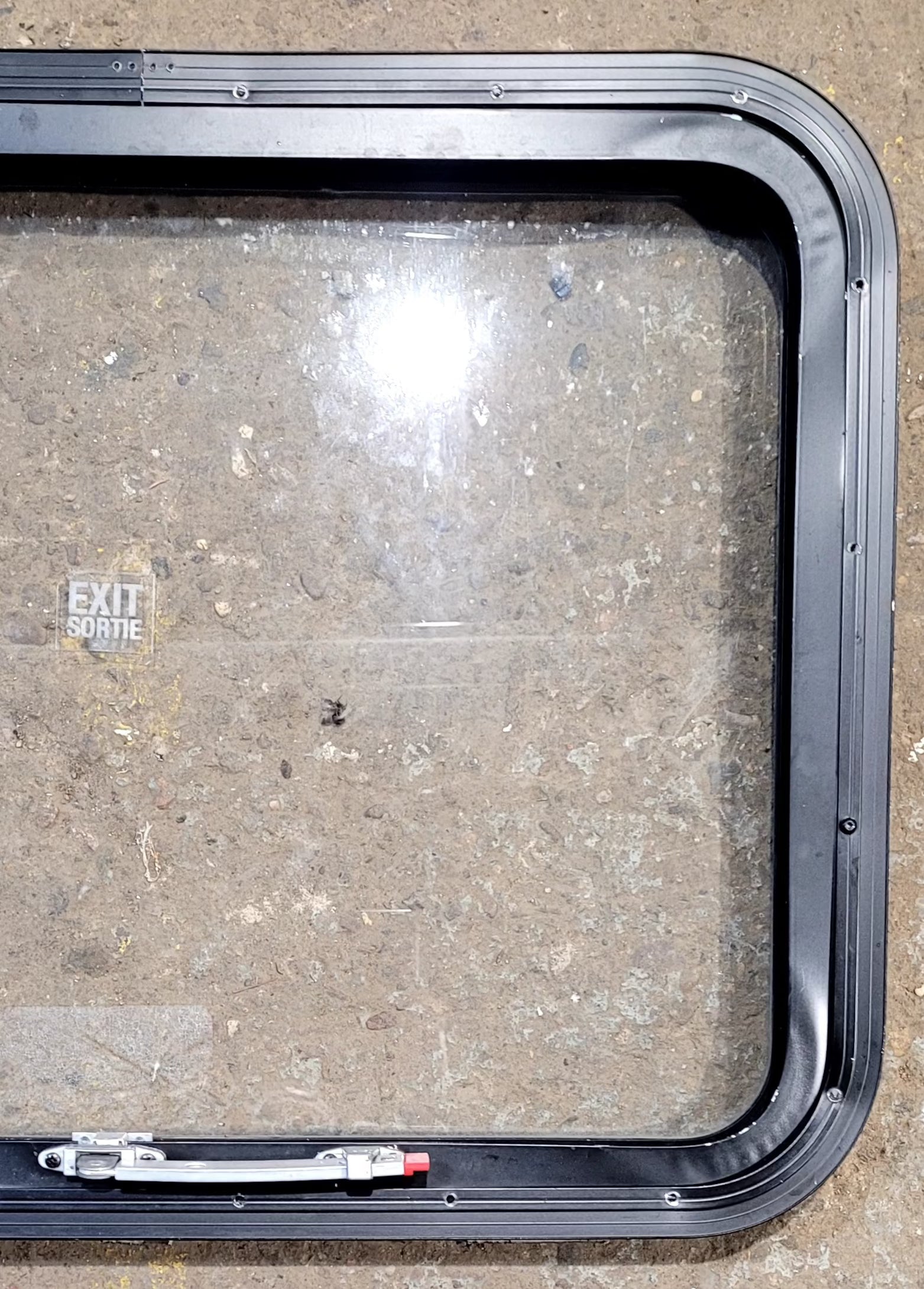 Used Black Radius Emergency Opening Window : 29 1/2" W x 21 1/2" H x 1 5/8" D - Young Farts RV Parts
