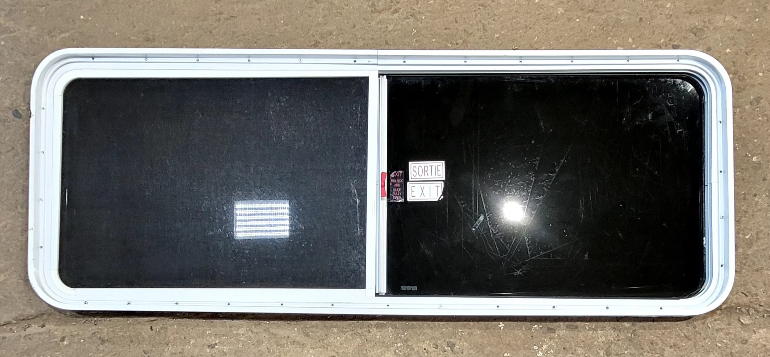 Used White Radius Emergency Opening Window : 59 1/2" W x 21 1/2" H x 1 3/4" D - Young Farts RV Parts