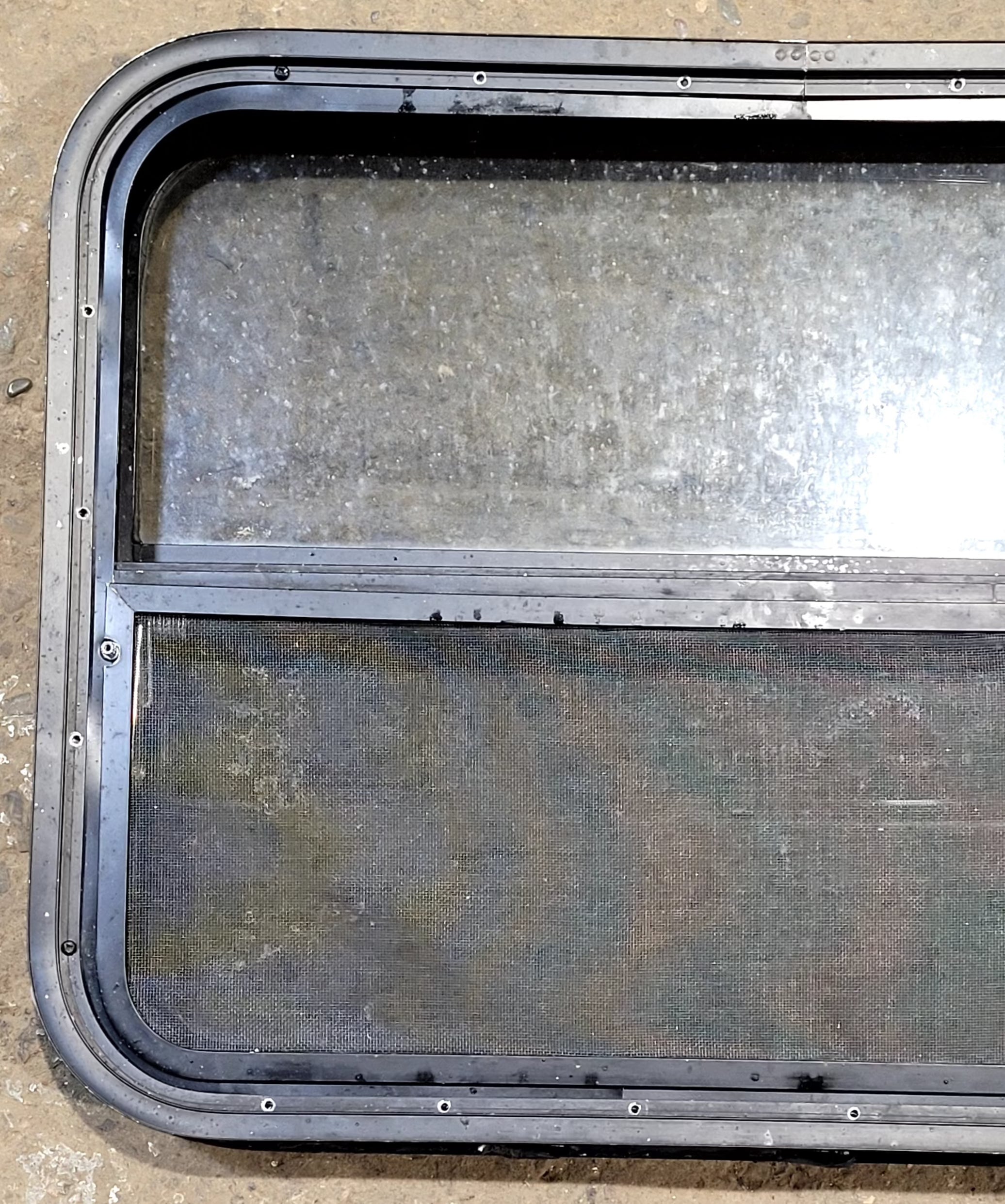 Used Black Radius Opening Window : 29 1/4" W x 21 1/4" H x 2" D - Young Farts RV Parts