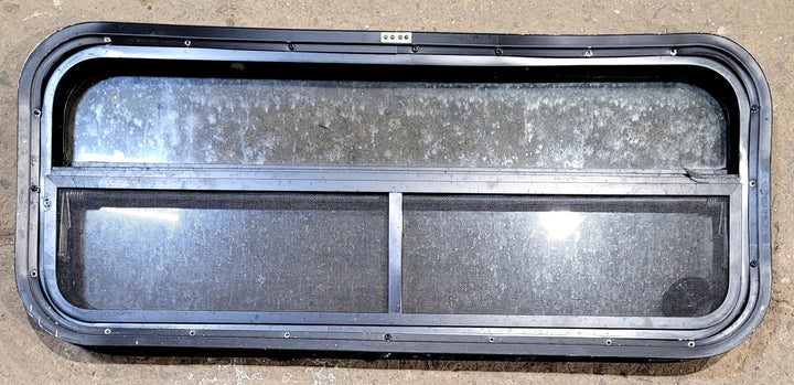 Used Black Radius Opening Window : 35 1/4" W x 14 1/4" H x 2" D - Young Farts RV Parts