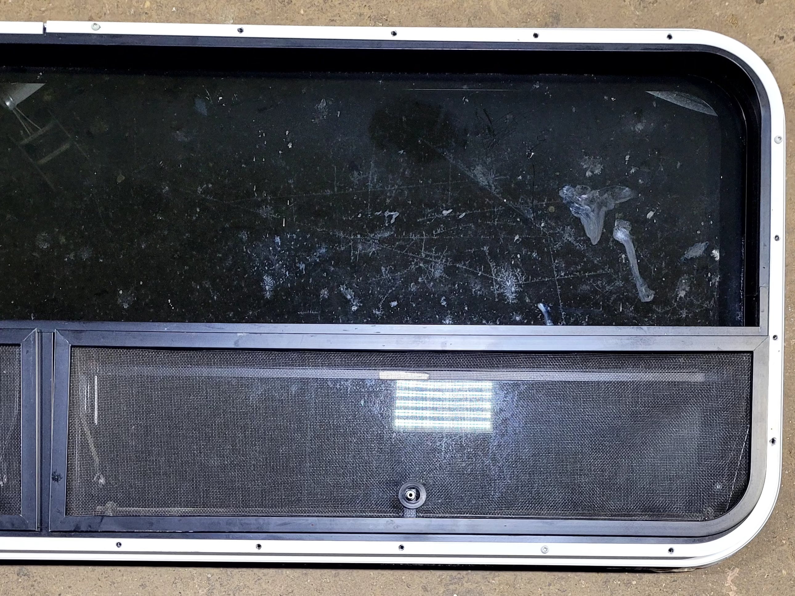 Used Black Radius Opening Window : 57 1/2" W x 20 1/4" H x 1" D - Young Farts RV Parts
