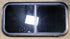 Used Black Radius Opening Window : 31 1/2" W x 15 1/4" H x 1 1/8" D - Young Farts RV Parts