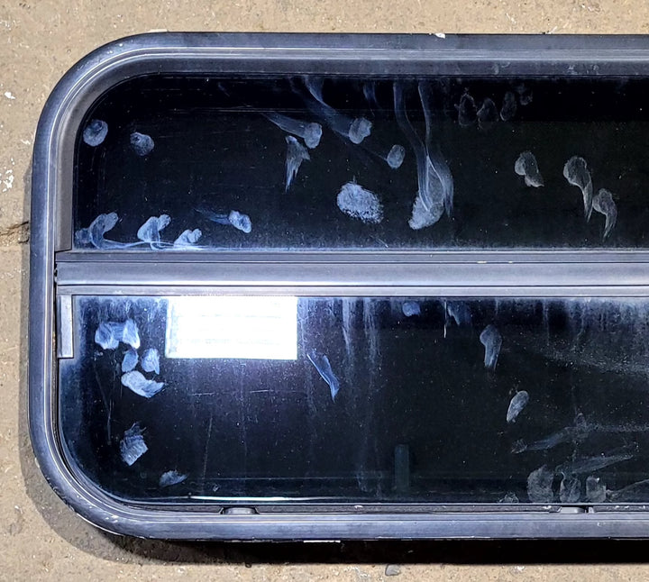 Used Slanted Black Radius Opening Window : 35 1/2" W x 14 3/4" H x 1 1/8" D - Young Farts RV Parts
