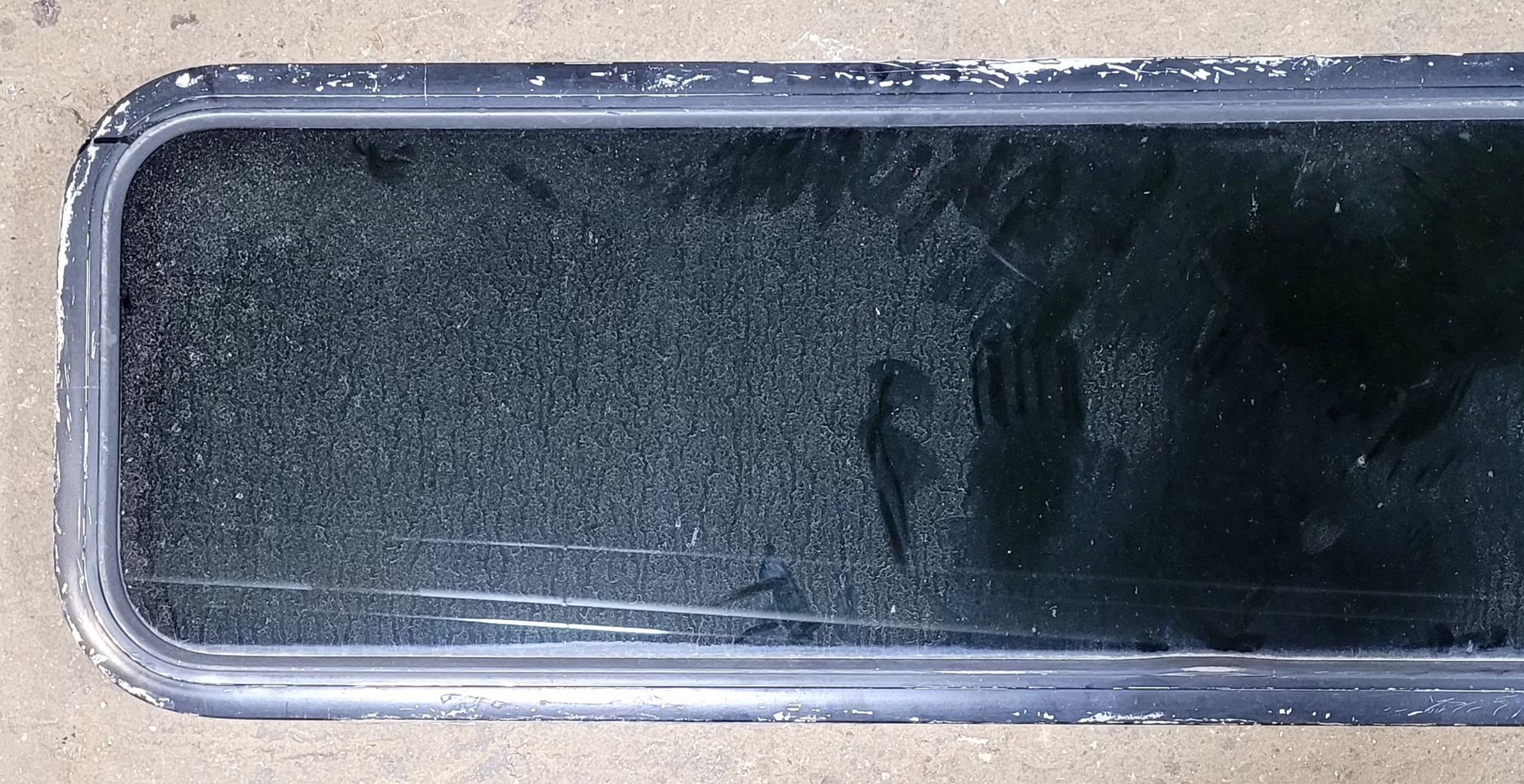 Used Black Radius Non Opening Window : 51 1/2" W x 14 1/4" H x 1" D - Young Farts RV Parts