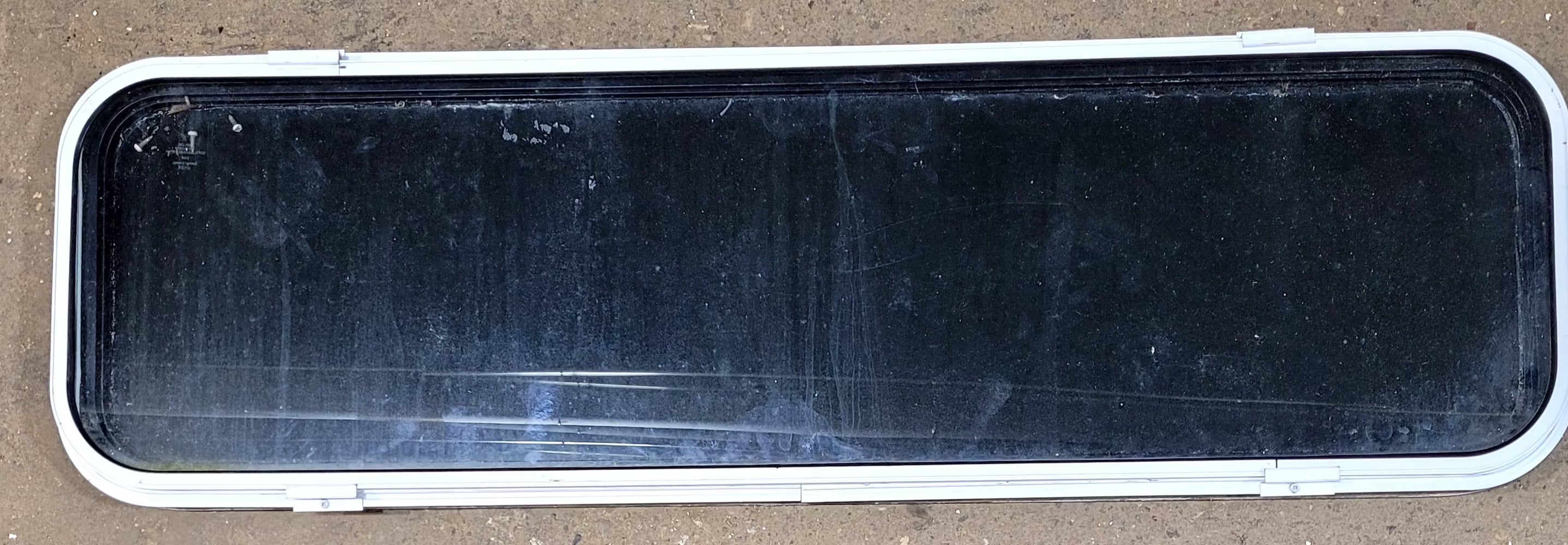 Used Black Radius Non Opening Window : 51 1/2" W x 14 1/4" H x 1" D - Young Farts RV Parts