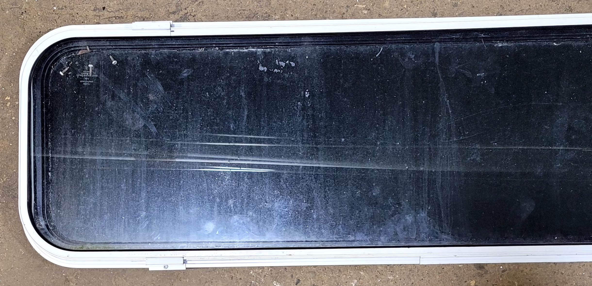 Used Black Radius Non Opening Window : 51 1/2" W x 14 1/4" H x 1" D - Young Farts RV Parts