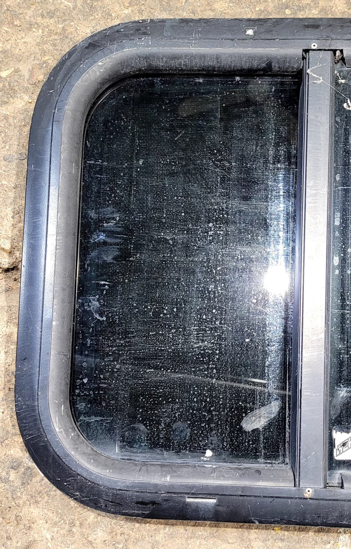 Used Black Radius Opening Window : 17 1/2" W x 14 1/4" H x 1 1/4" D - Young Farts RV Parts