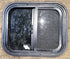 Used Black Radius Opening Window : 17 1/2" W x 14 1/4" H x 1 1/4" D - Young Farts RV Parts