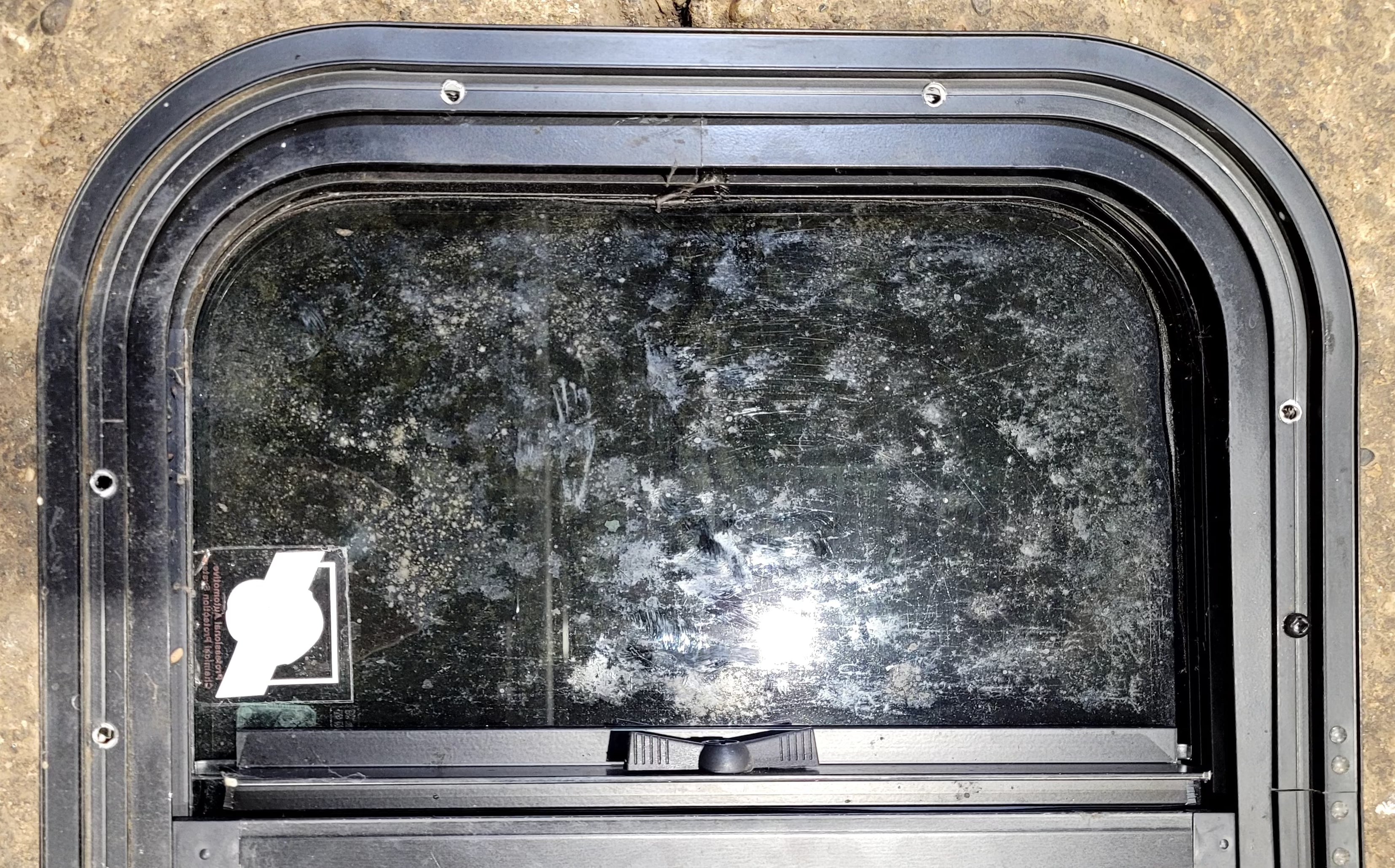 Used Black Radius Opening Window : 17 1/2" W x 14 1/4" H x 1 1/4" D - Young Farts RV Parts