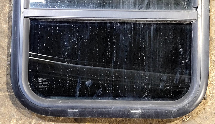 Used Black Radius Opening Window : 17 1/2" W x 21 1/2" H x 1 3/4" D - Young Farts RV Parts