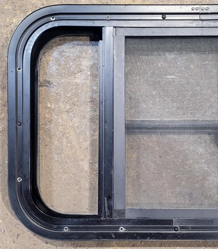 Used Black Radius Opening Window : 23 1/4" W x 15 1/4" H x 1 3/4" - Young Farts RV Parts