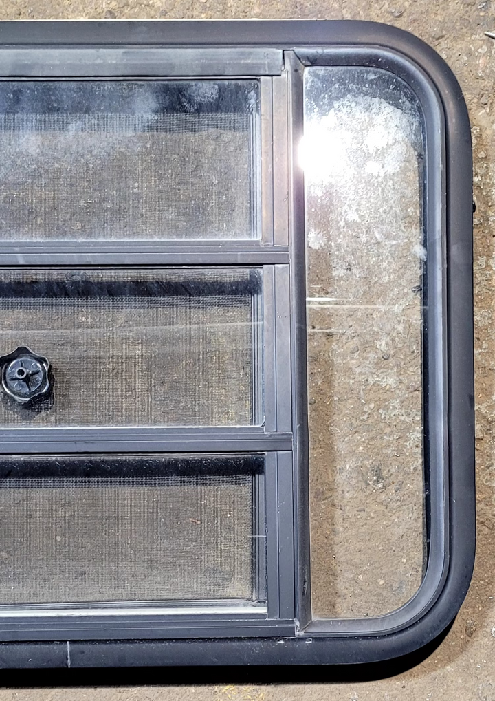 Used Black Radius Opening Window : 29 1/4" W x 22 1/4" H x 1 3/4" - Young Farts RV Parts