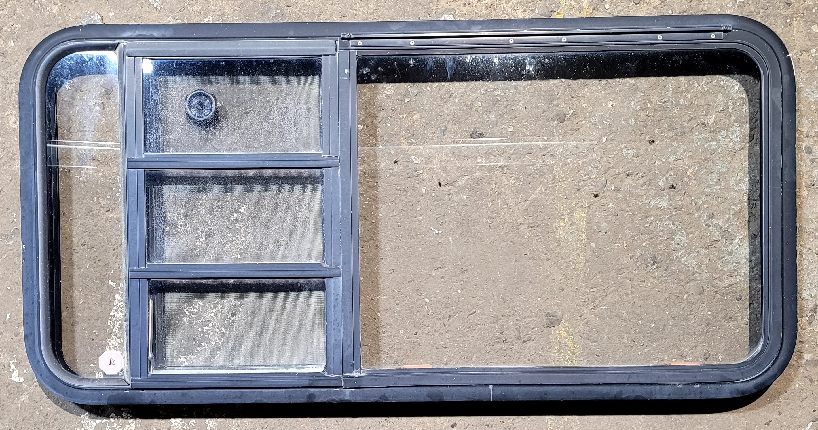 Used Black Radius Emergency Opening Window : 47 1/4" W x 22 1/4" H x 1 3/4" - Young Farts RV Parts