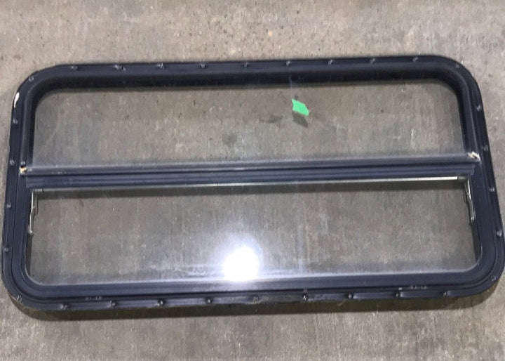 USED Black Radius Opening Window : 42 1/2" W x 22 1/2" H x 2" D - Young Farts RV Parts
