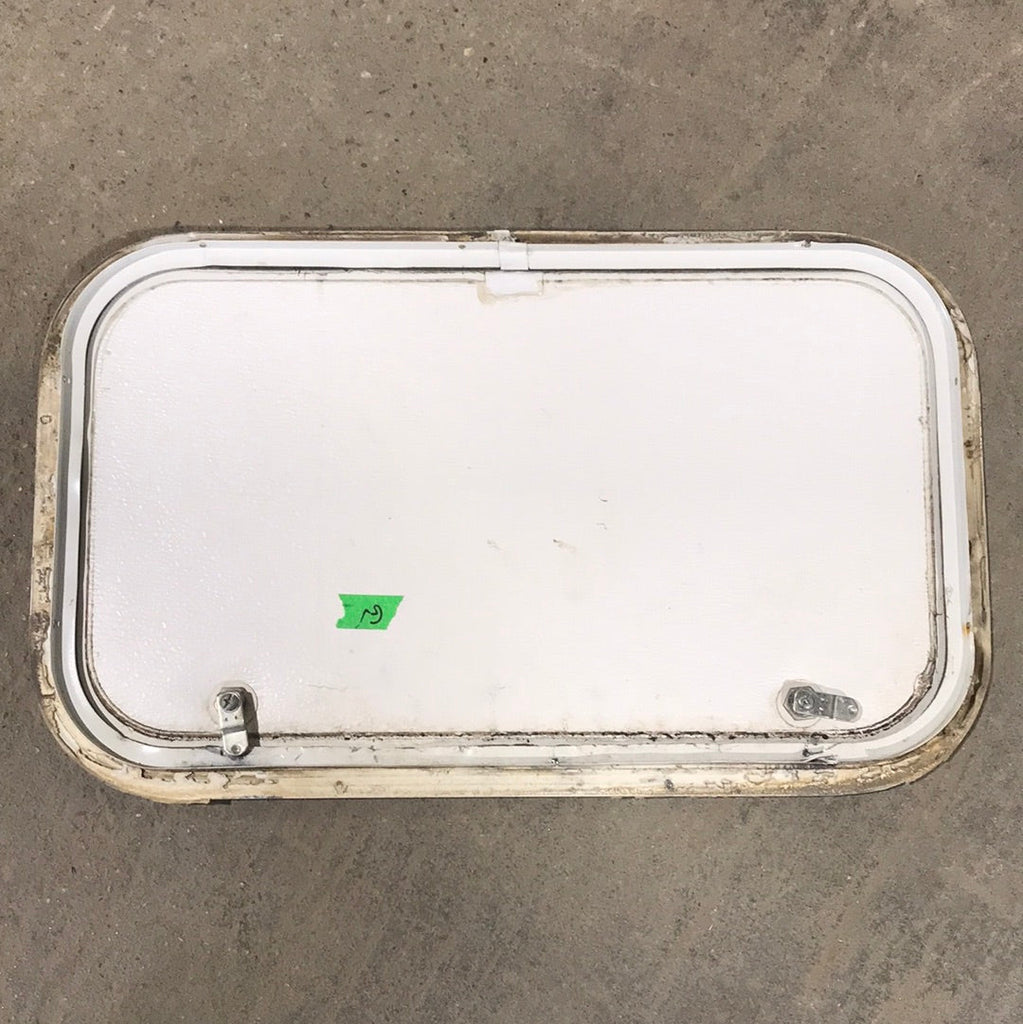 Used White Corner radius cargo door  23 3/4" W x 13 3/4" H x 1"D