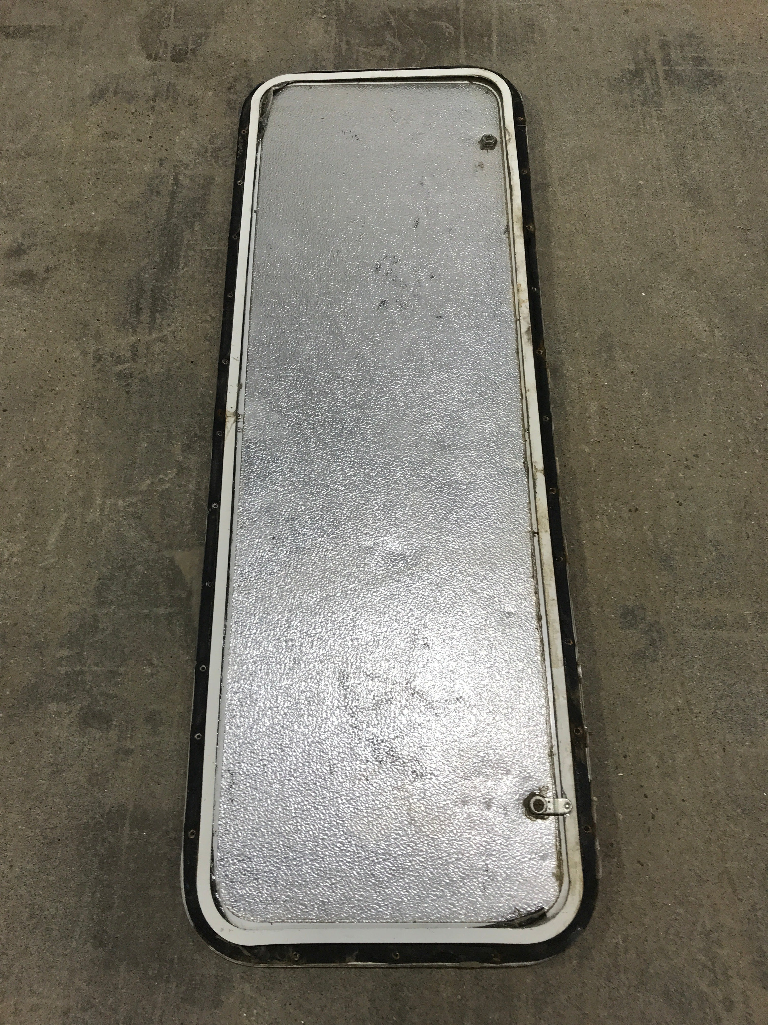 Used Radius Cornered Cargo Door 47 3/4" W x 15 3/5" H x 1/2" D - Young Farts RV Parts