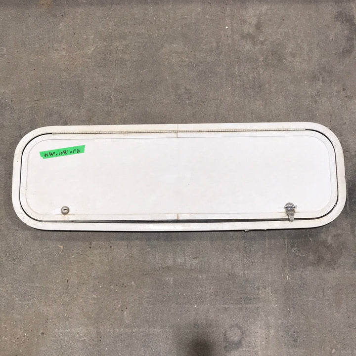 Used Radius Cornered Cargo Door 35 3/4" W x 10 5/8" H x 1"D - Young Farts RV Parts