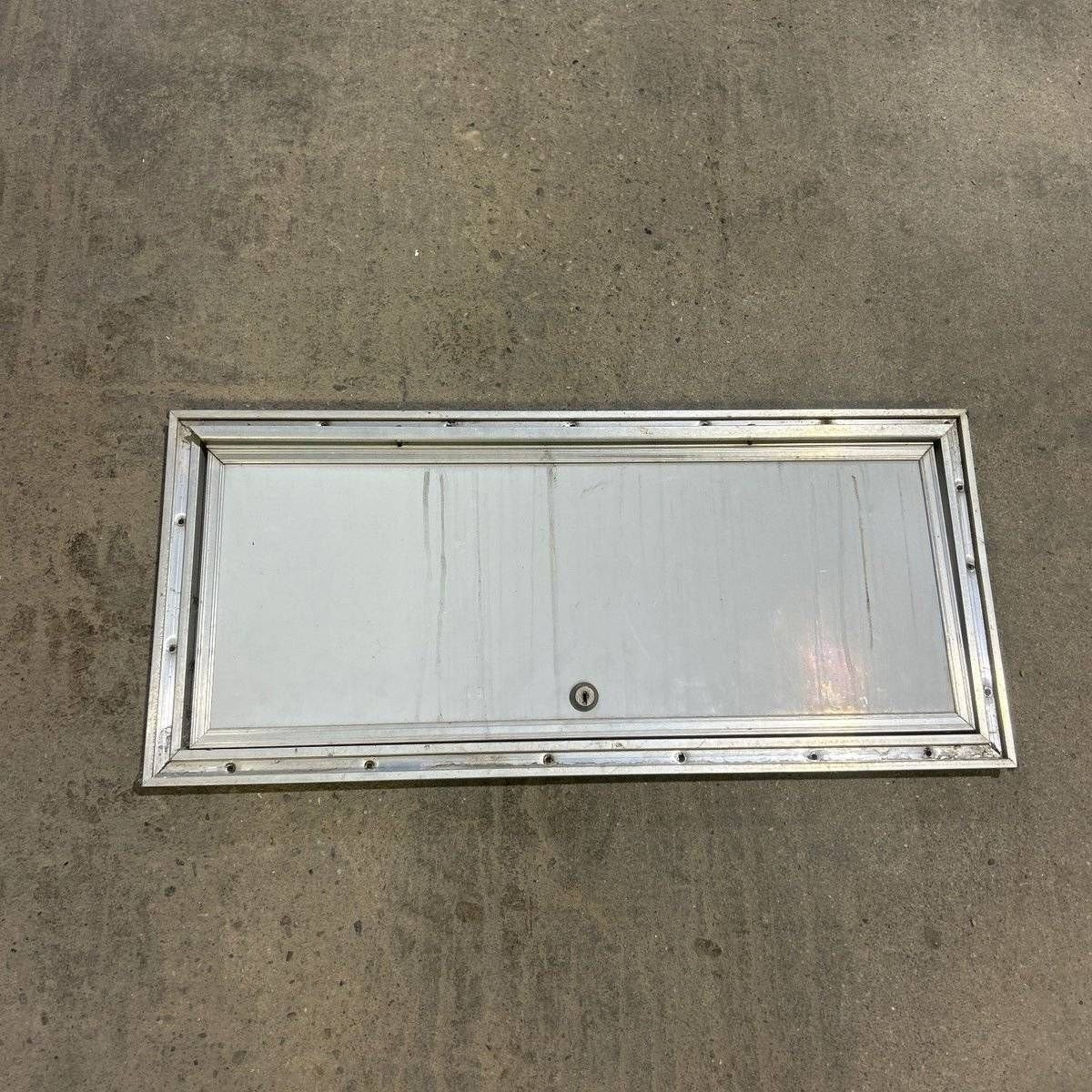 Used Square Cornered Cargo Door 10.75 X 13.75 X .50 - 23.75 X 9.75 X .75 - Silver Trim