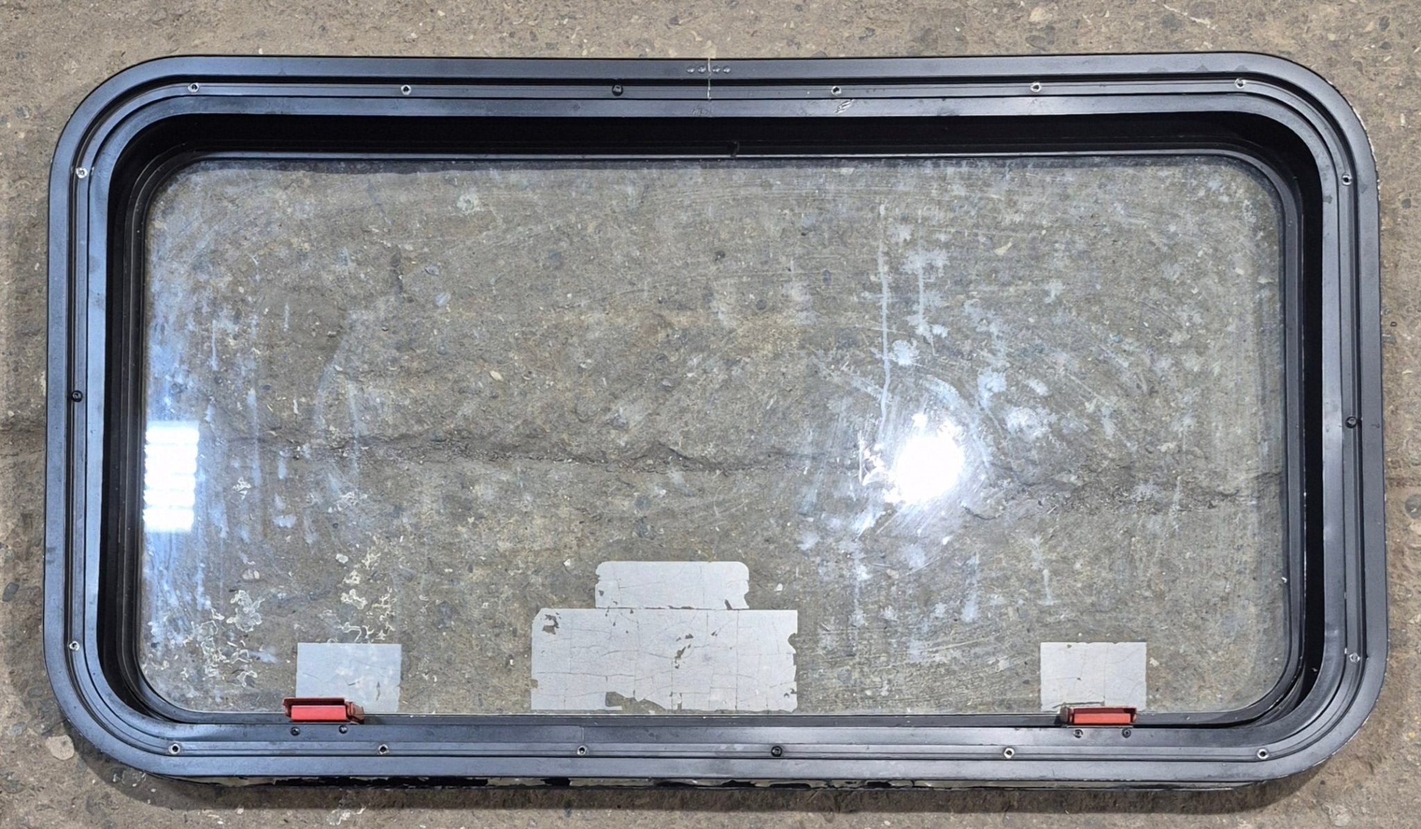 Used Black Emergency Radius Opening Window : 35 1/2" W x 18 3/4" H x 1 7/8" - Young Farts RV Parts