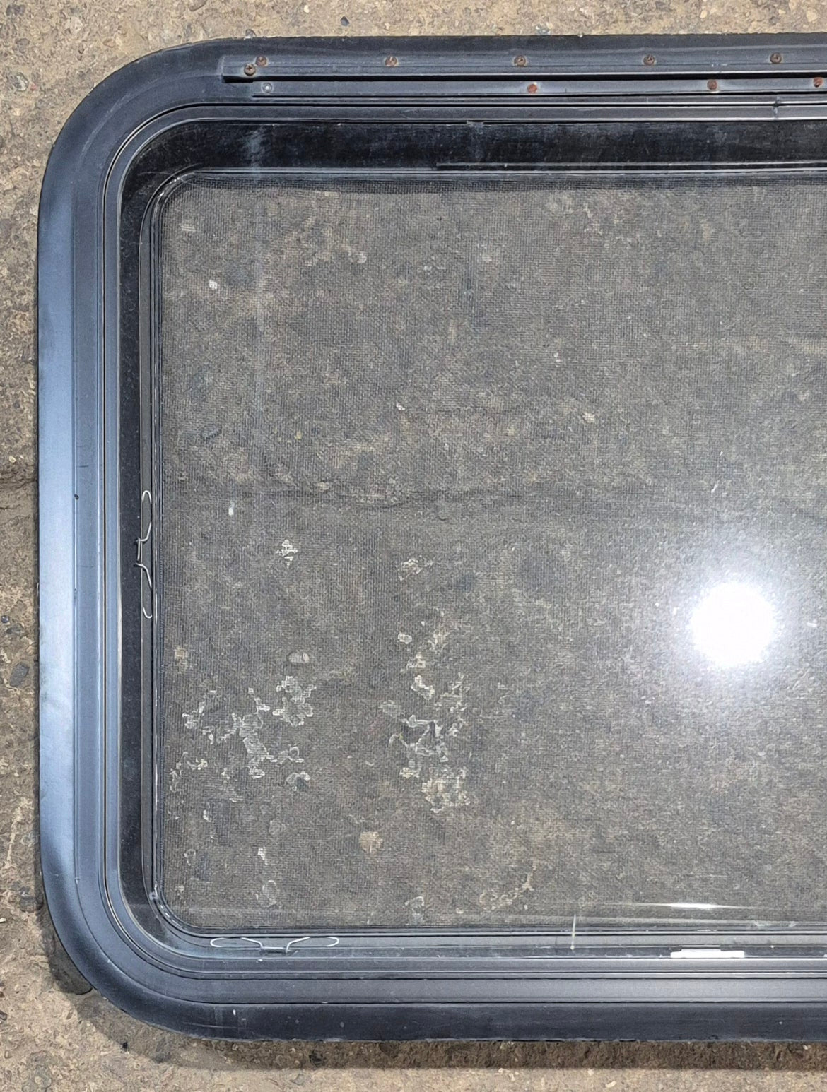 Used Black Radius Emergency Opening Window : 29 1/2" W x 21 1/2" H x 1 1/2" - Young Farts RV Parts