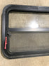Used Black Radius Emergency Opening Window : 29 1/2" W x 21 1/2" H x 1 7/8" D - Young Farts RV Parts