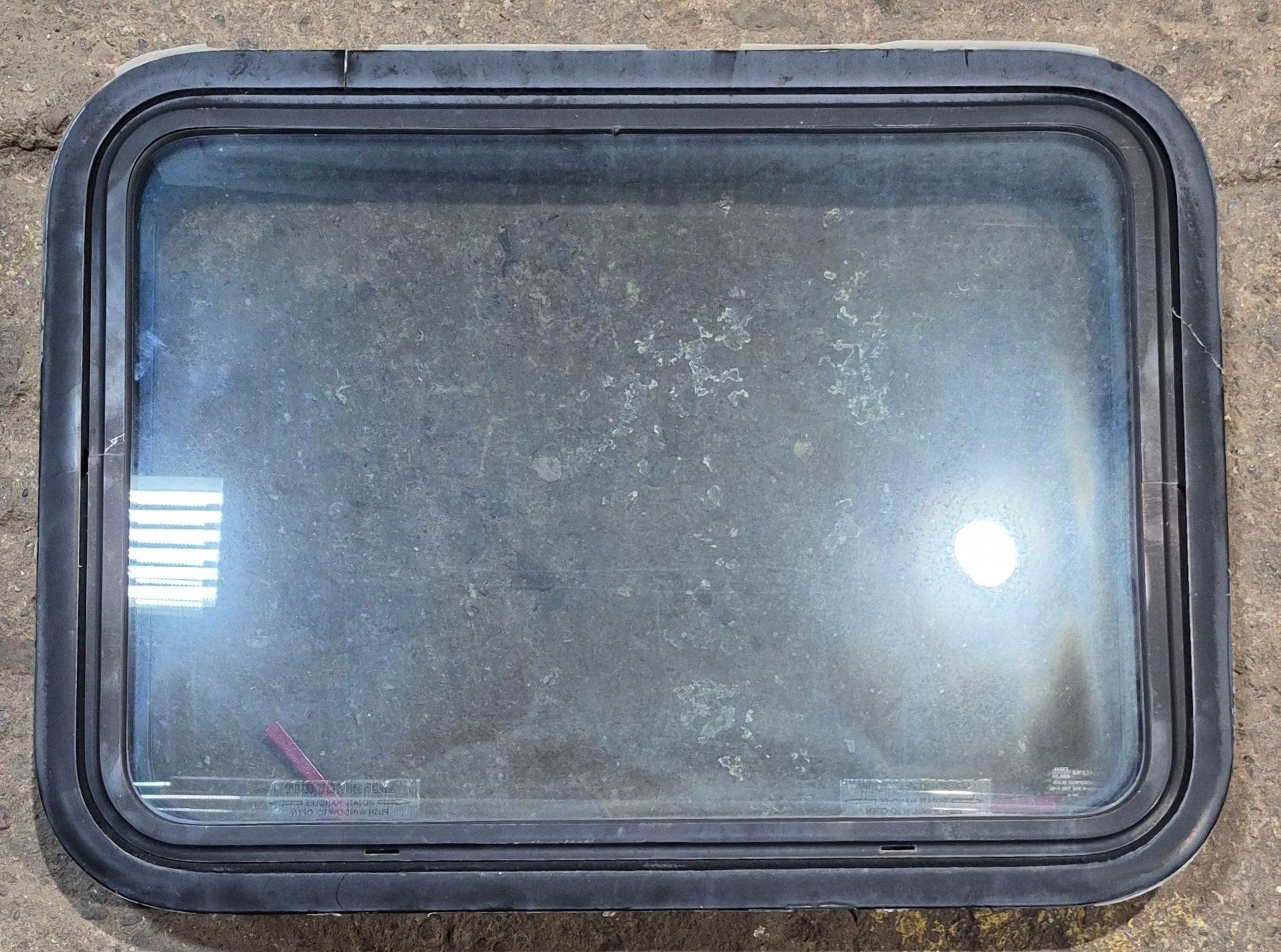 Used Black Radius Emergency Opening Window : 29 1/2" W x 21 1/2" H x 2" D - Young Farts RV Parts