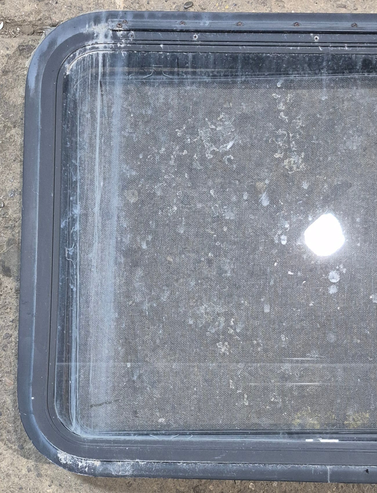 Used Black Radius Emergency Opening Window : 29 1/2" W x 22 1/2" H x 1 3/4" - Young Farts RV Parts