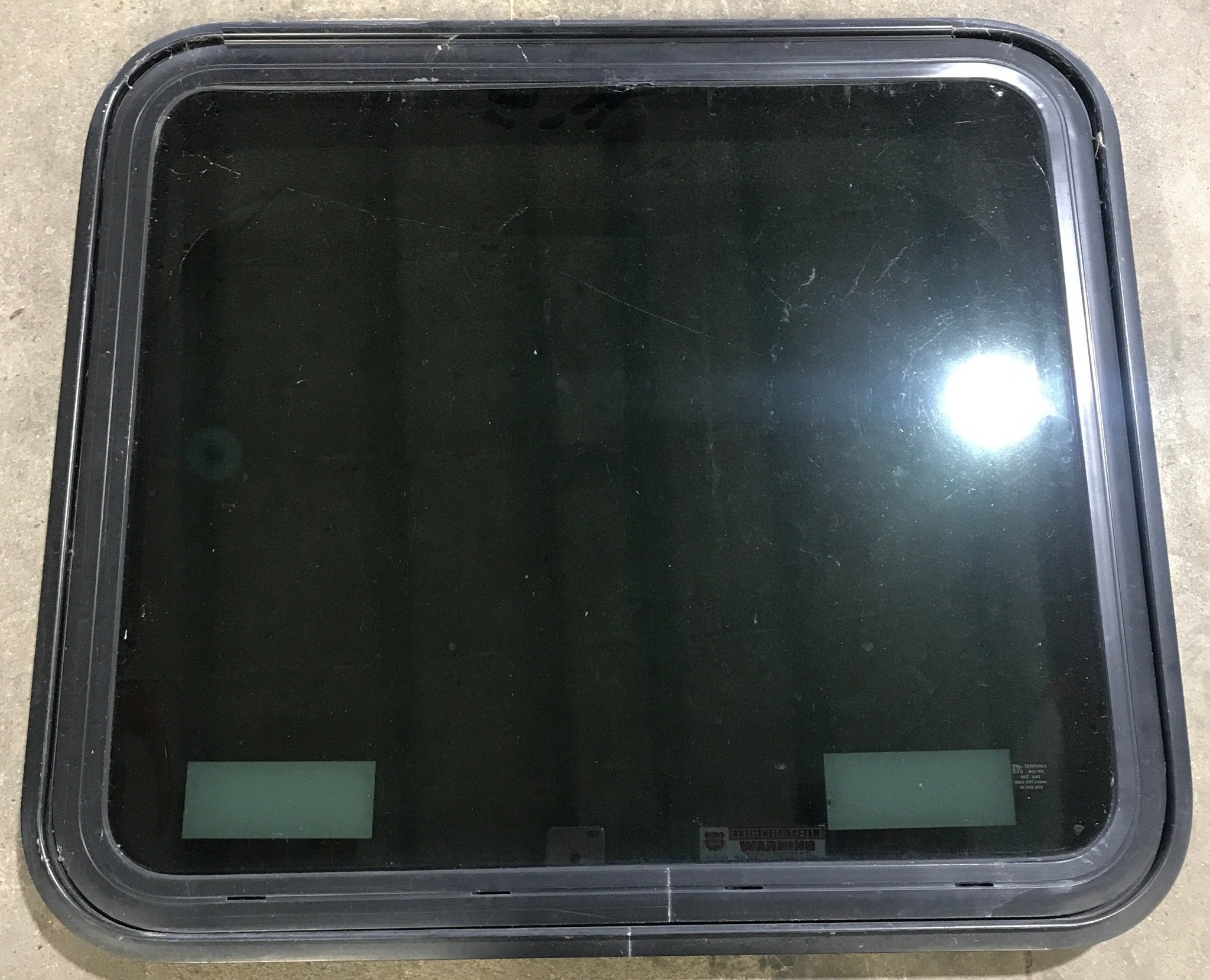 Used Black Radius Emergency Opening Window : 29 1/2" W x 25 1/2" H x 1 7/8" D - Young Farts RV Parts
