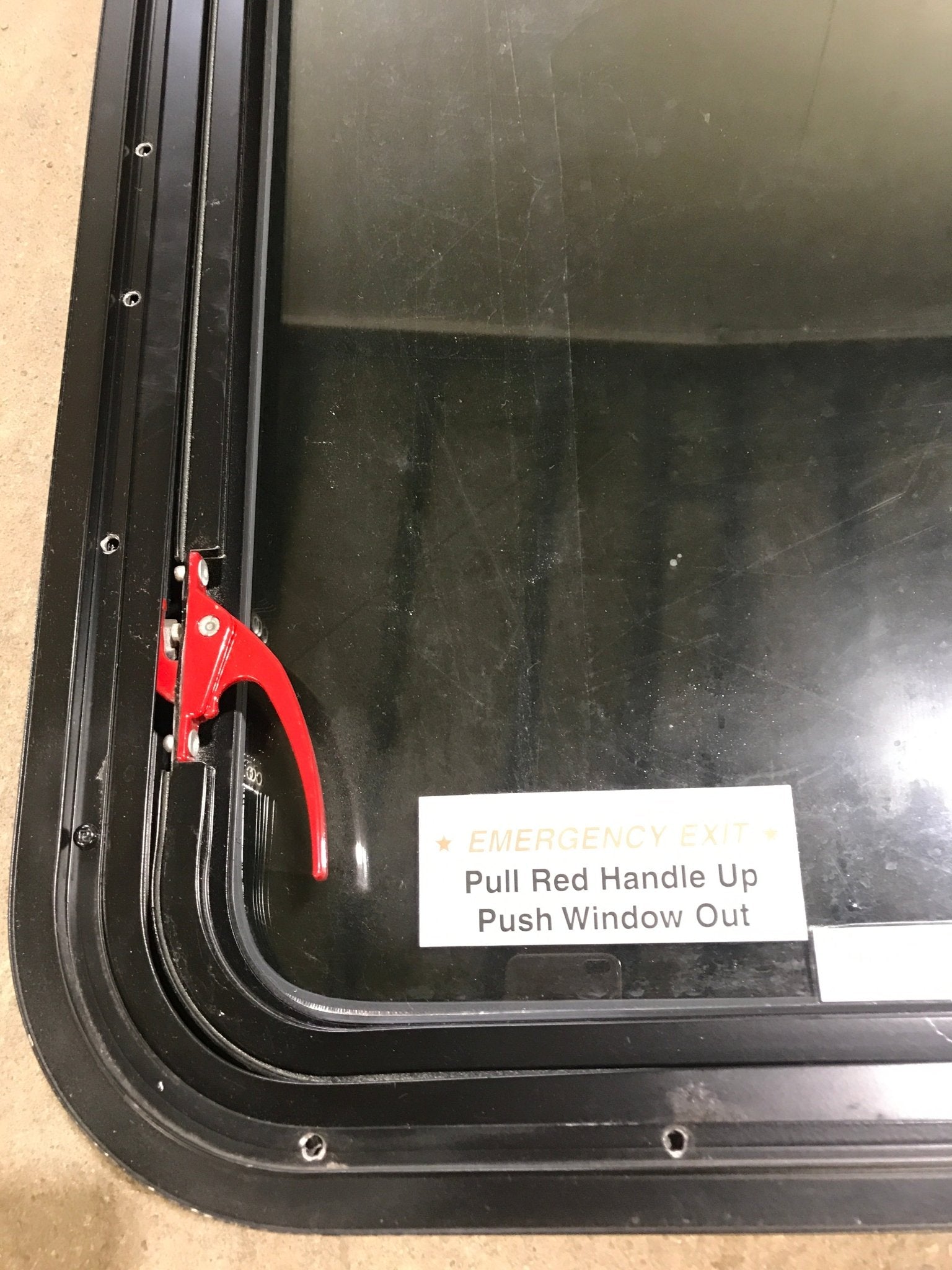 Used Black Radius Emergency Opening Window : 29 1/2" W x 25 1/2" H x 1 7/8" D - Young Farts RV Parts