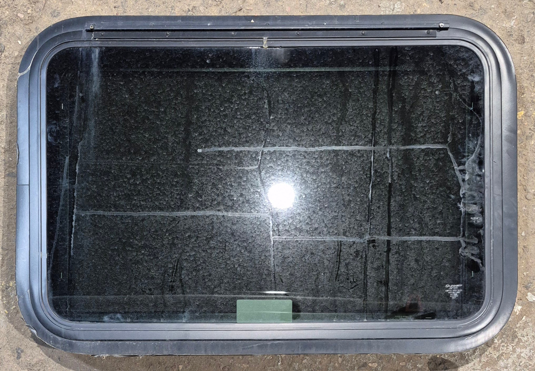 Used Black Radius Emergency Opening Window : 29 1/4" W x 19 1/4" H x 1 1/4" - Young Farts RV Parts