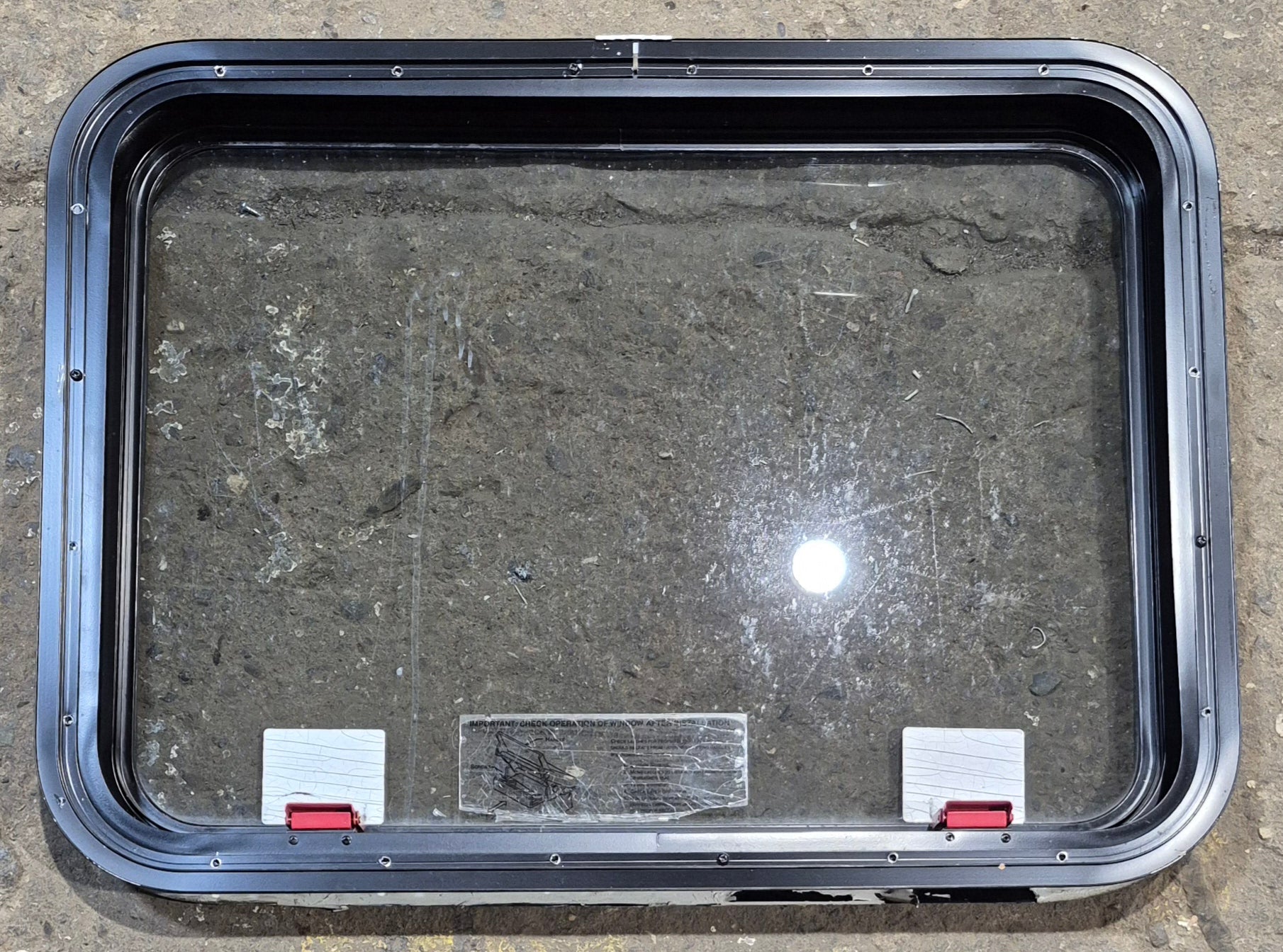 Used Black Radius Emergency Opening Window : 29 1/4" W x 21 1/2" H x 1 3/4" - Young Farts RV Parts